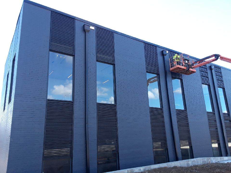 Field installation work on exterior architectural metal panels